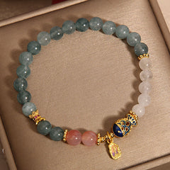 Jade Agate Koi Scripture Bracelet – close-up of carved koi fish bead with scripture ring detail