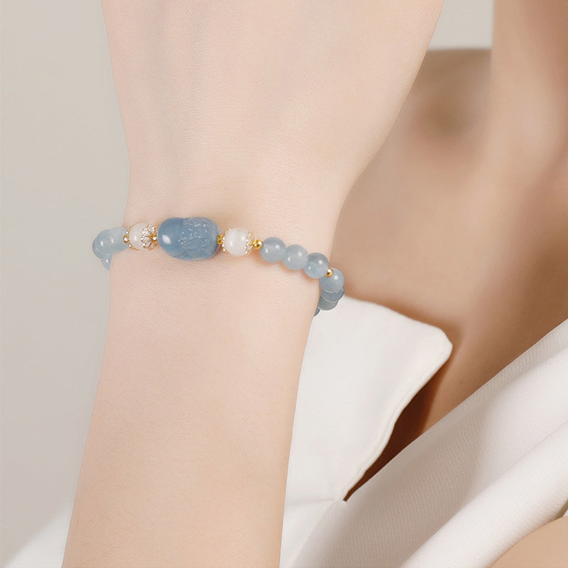 Aquamarine PiXiu Bracelet – model wrist soft blue beads carved PiXiu charm, feng shui luck