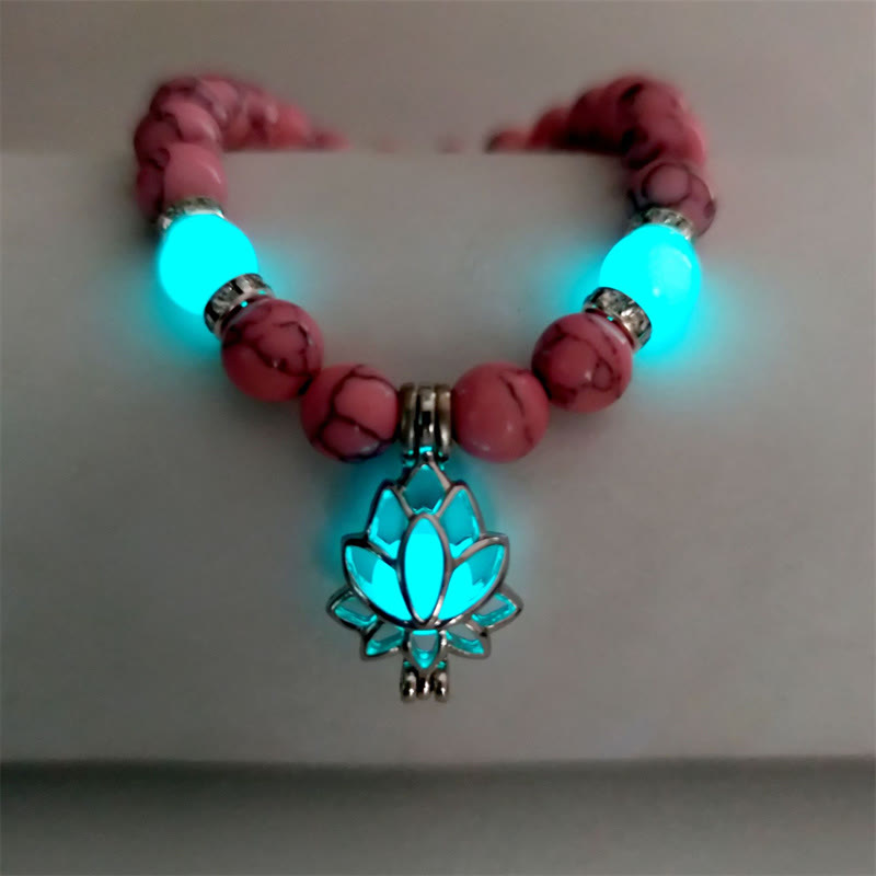 Tibetan Turquoise Glowstone Lotus Bracelet – pink howlite beads with cyan glow lotus pendant curved display, pink lotus
