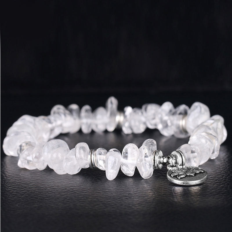 Natural White Crystal Lotus Bracelet – Shallow depth macro of raw chip beads, crystal healing