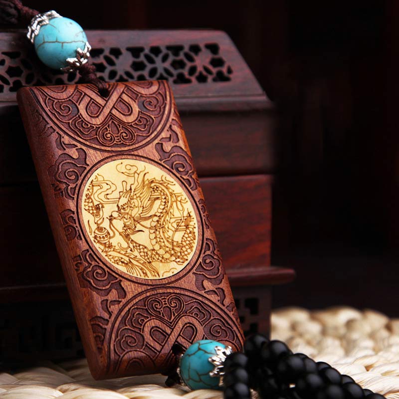 Rosewood Dragon Decoration – angled view showing golden dragon inlay and carved knotwork border, Healing