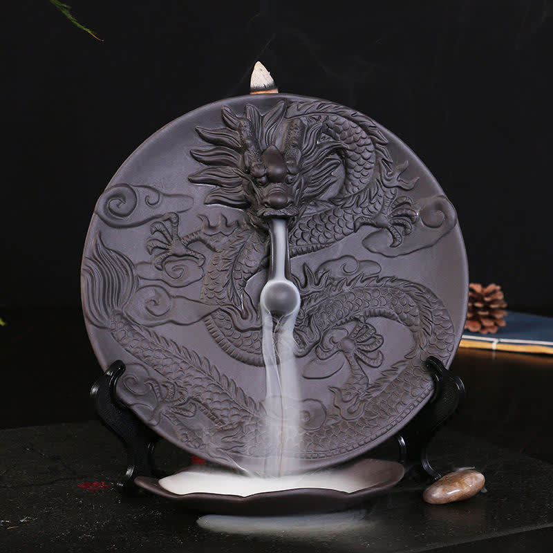 Dragon Backflow Burner on black surface, smoke waterfall effect, pine cone prop, meditation calm