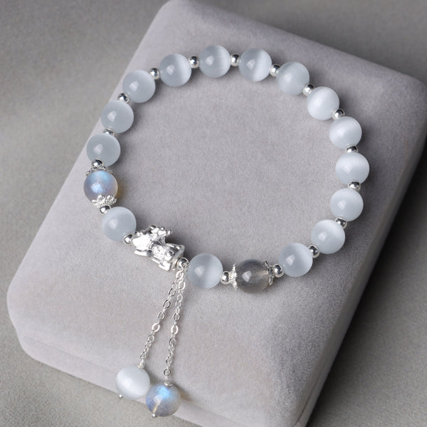 Cat's Eye PiXiu Bracelet – Gray cushion display with cat's eye moonstone beads and silver accents