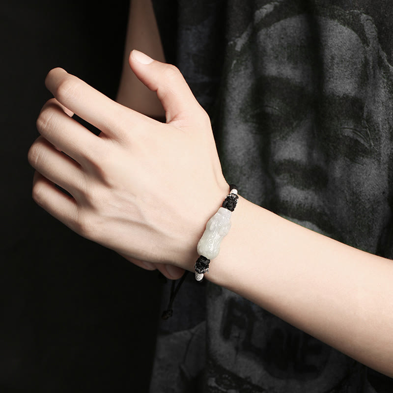 Natural Jade PiXiu Bracelet – hand model close-up wearing bracelet, dark background, jade bracelet luck