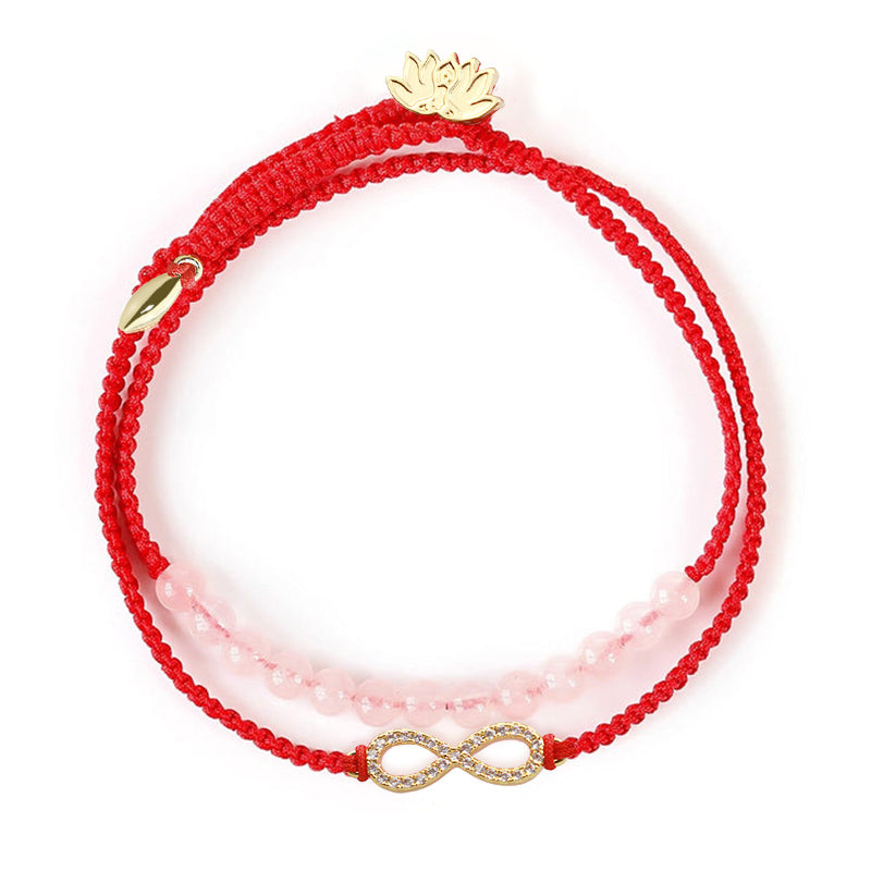 Tibetan Lotus Pink Crystal Red String Bracelet - dual-strand red cord and pink beads with crystal infinity charm, top-down view