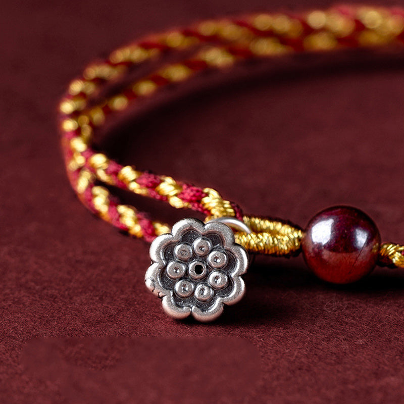 Red Gold Rope Lotus Braid Bracelet - macro angled view of lotus pod and garnet bead detail