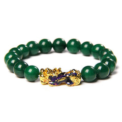 Jade Pixiu Bracelet – Straight on view green jade beads gold-blue PiXiu white backdrop, feng shui luck charm