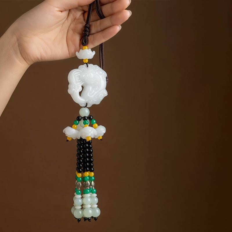 FengShui Jade PiXiu Car Pendant – hand holding white jade PiXiu ornament, black green yellow beaded tassel detail
