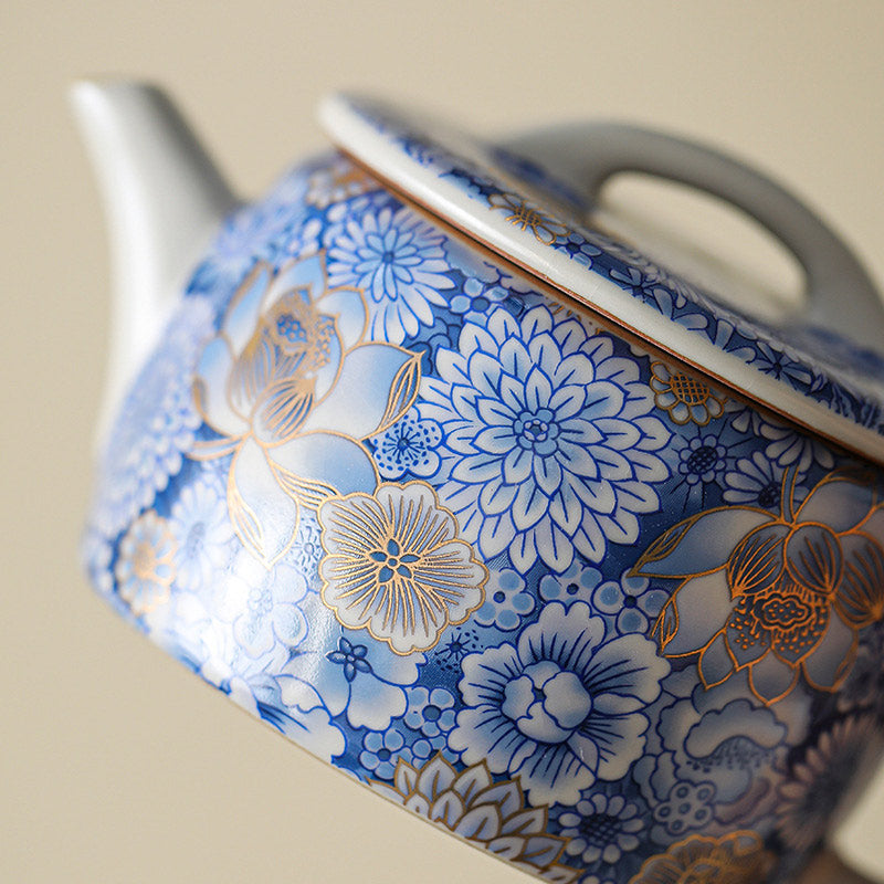 Lotus Chrysanthemum Ceramic Teapot - Low angle showcasing body curvature and gold trim, artisanal
