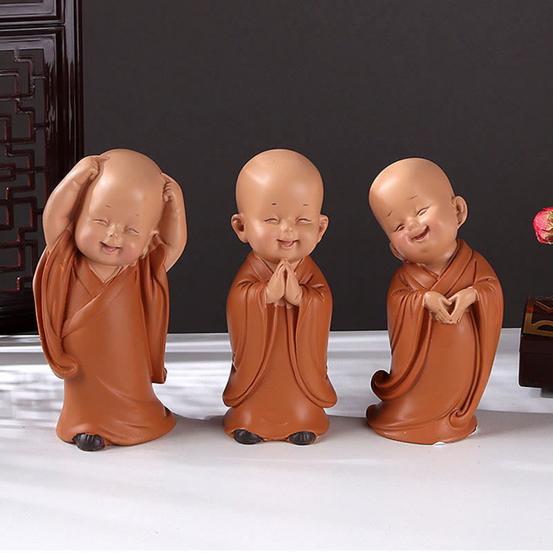 Mini Praying Monk Decor – close-up of closed eyes and gentle smile, tranquility expression macro