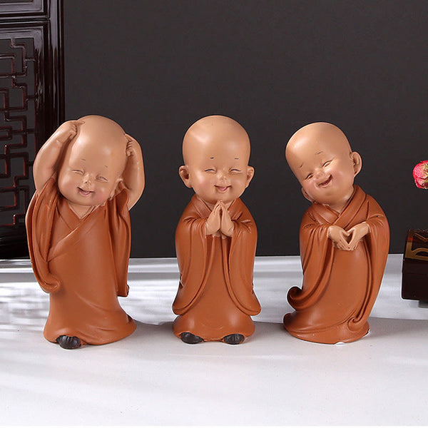 Mini Praying Monk Decor – close-up of closed eyes and gentle smile, tranquility expression macro