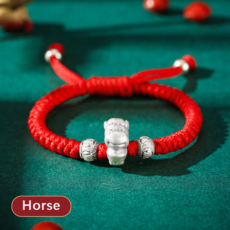 999 Sterling Silver Zodiac Red Rope Kids Bracelet - Silver goat charm on red braided cord on teal background, zodiac keepsake
