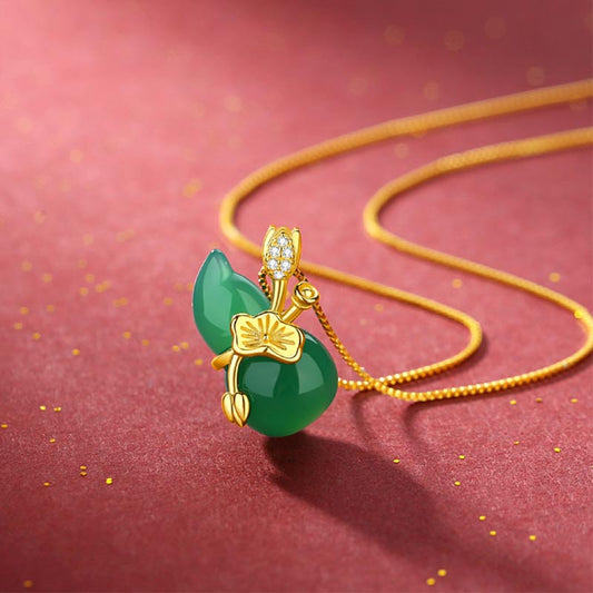 Cyan Jade Gourd Pendant Necklace - angled view showing gold plum blossom and jade leaf detail, abundance charm