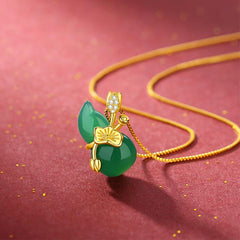 Cyan Jade Gourd Pendant Necklace - angled view showing gold plum blossom and jade leaf detail, abundance charm