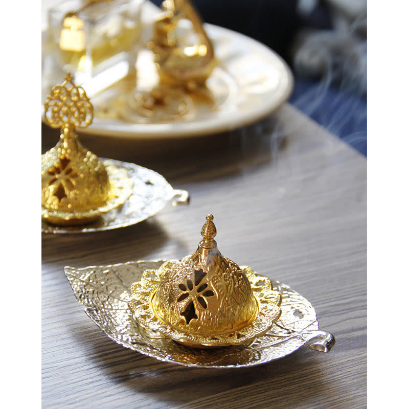 Tibetan Gold Leaf Coaster Incense Burner – Two gold burners on silver leaf trays with smoke on wood, brass incense holders