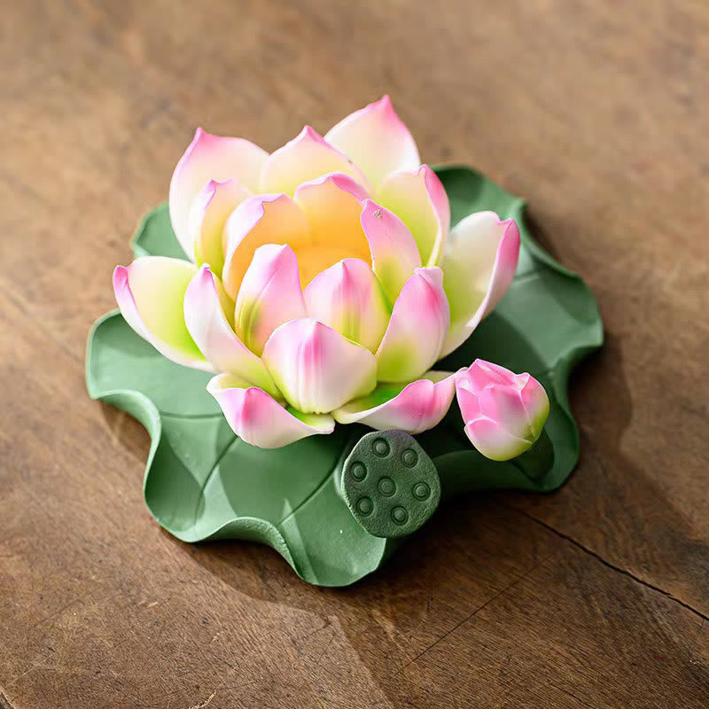 Lotus Ceramic Incense Burner - close-up of pink lotus with bud and seed pod on green leaf, artisan craft