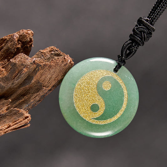 Yin Yang Crystal Necklace – Translucent green aventurine disc pendant with metallic gold yin-yang inlay, polished stone finis