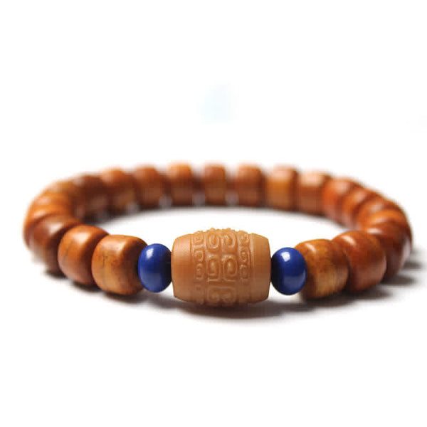 Tibetan Bone Beads Om Mani Padme Hum Bracelet – carved cream bead flanked by lapis blue accents, spiritual bead bracelet