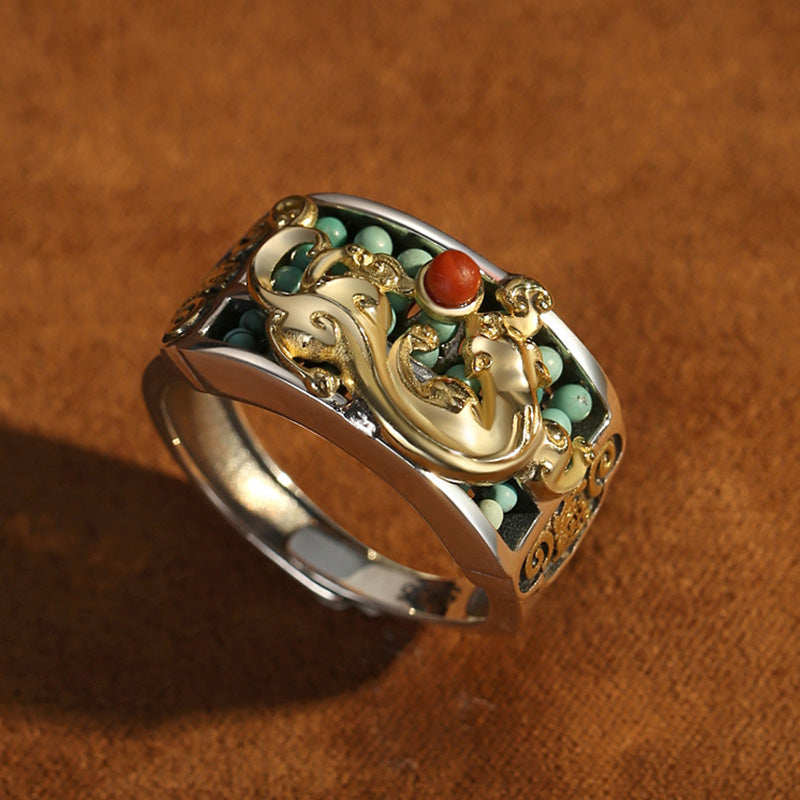 Silver PiXiu Ring – Worn on index finger showing gold PiXiu against black shirt, protection jewelry