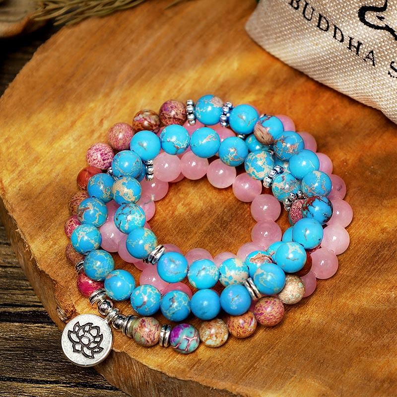 Tibetan Purple Miano Bead Lotus Mala - turquoise and pink beads with lotus pendant on wood, prayer beads