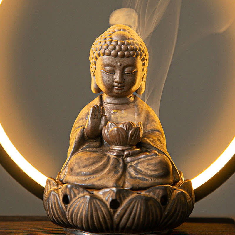 Buddha incense burner with crescent LED moon light, smoke wisps and gray backdrop, zen spiritual decor