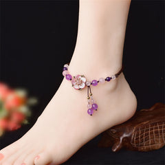 Amethyst Rose Quartz Crystal Charm Healing Anklet - Brown agate yin-yang bracelet on glossy black marble, gold metal space...