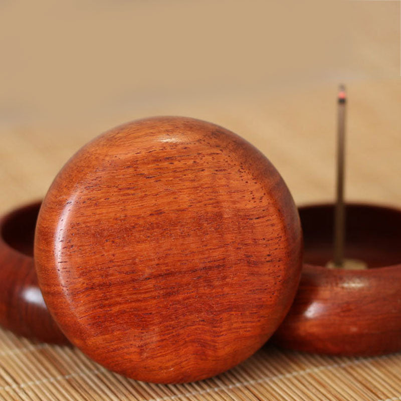Rosewood Incense Burner – domed wooden lid in foreground, burning incense visible in base behind, mindful