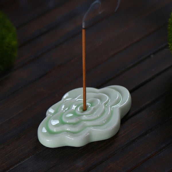 Mini Auspicious Clouds Ceramic Incense Burner – green cloud-shaped ruyi holder with burning stick and smoke on dark wood, celadon incense burner
