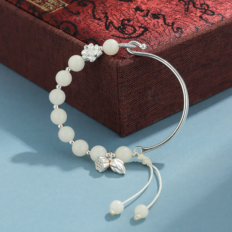 Bodhi Seed Butterfly Lotus Bracelet – On wooden display stand, Feng Shui bodhi decor