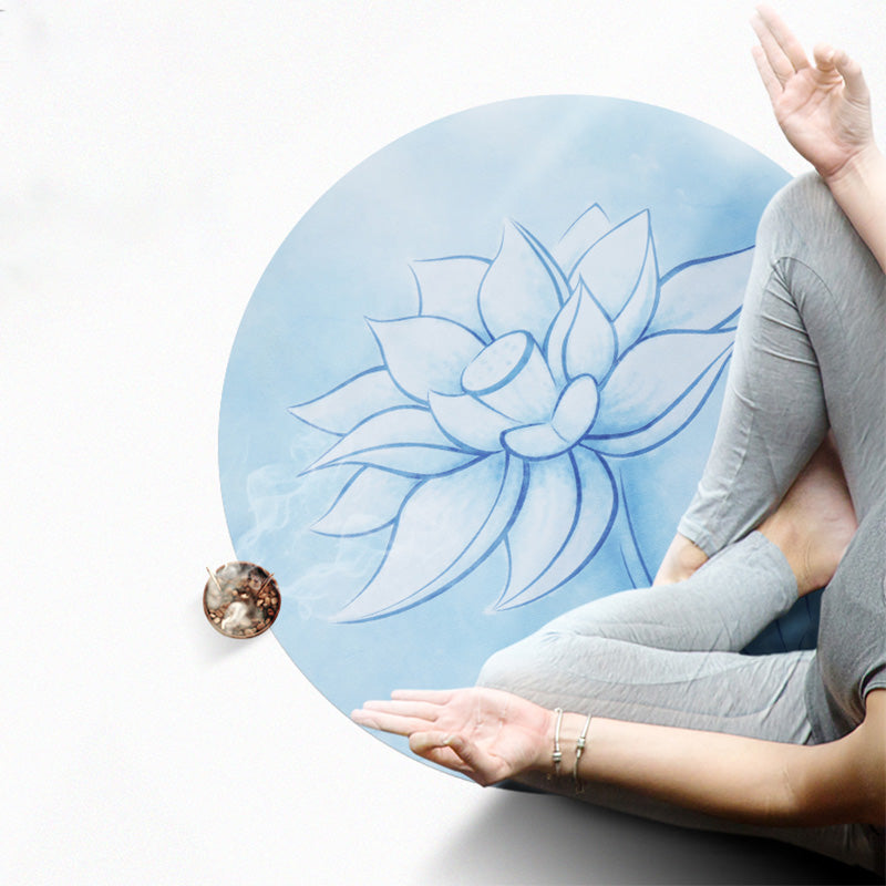 Lotus Mandala Yoga Mat – Woman meditating on round blue lotus mat with incense smoke, gray activewear, zen
