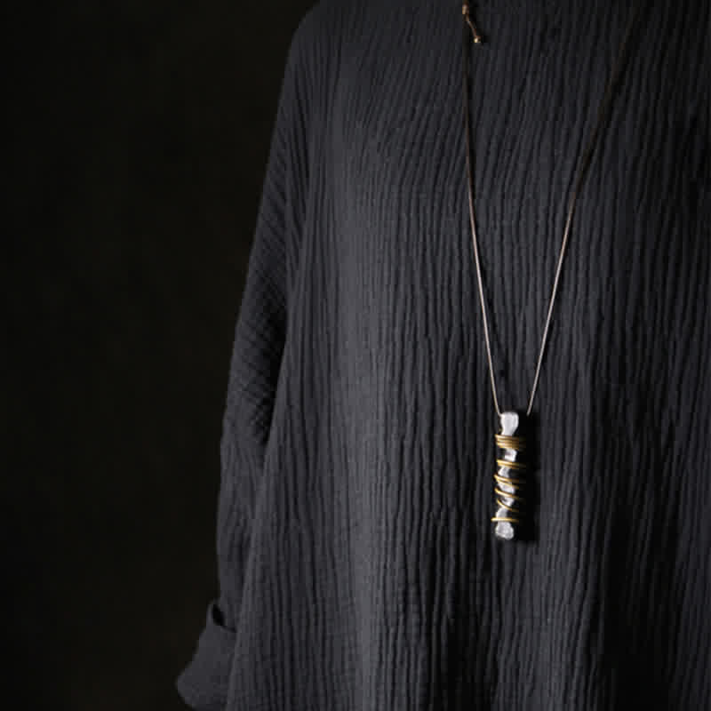 Ebony Wood Pendant Necklace – Model wearing crystal pendant and gold bracelet, zen fashion