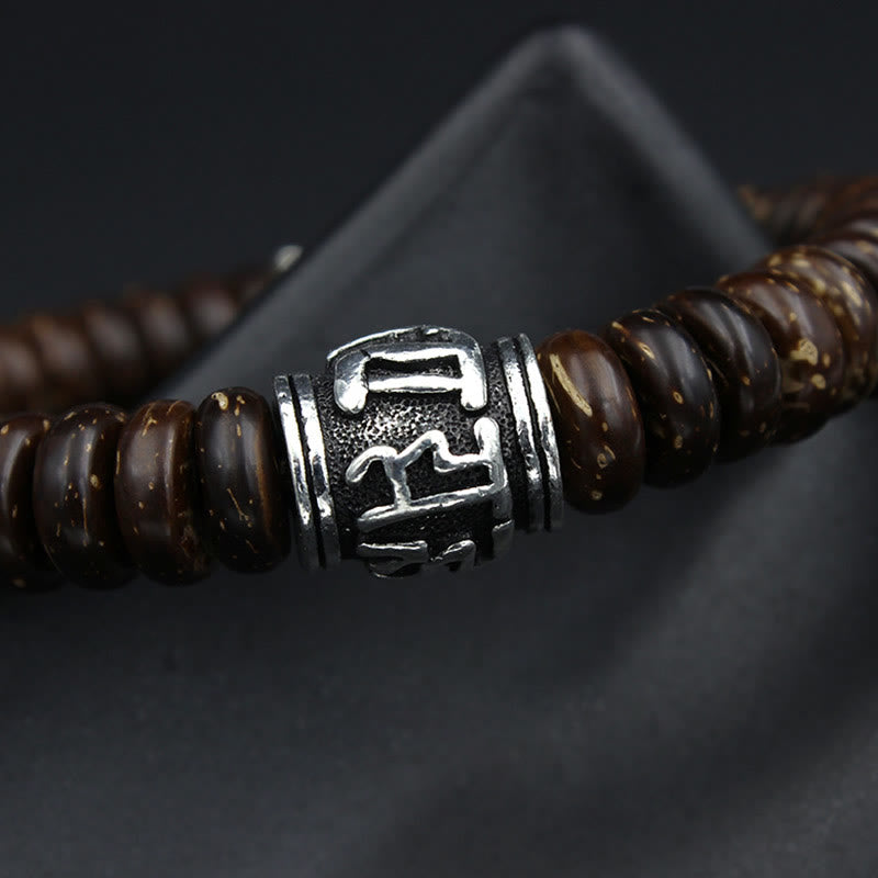 Om Mani Padme Hum Coconut Shell Bracelet – side angle detail shot, metal focal bead