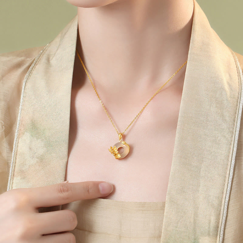 White Chalcedony Lotus S925 Necklace - model wear with hand at neckline, gold lotus jewelry