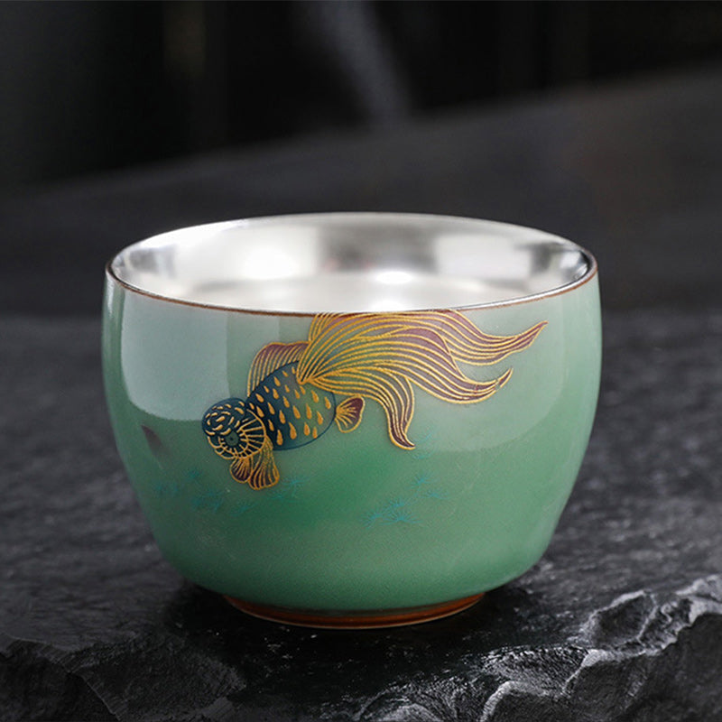 Butterfly Goldfish Lotus Cup – detail of butterfly wing art on ceramic, tea ware