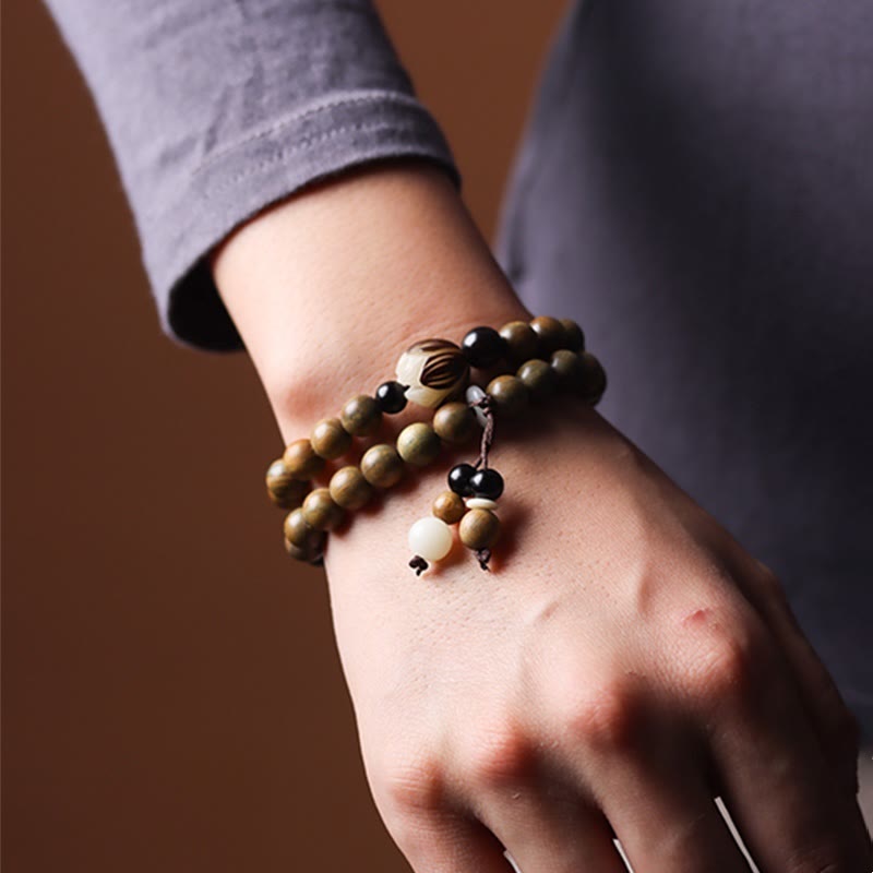 Green Sandalwood Lotus Bracelet – double wrapped on wrist with gray cuff, lotus bead accent