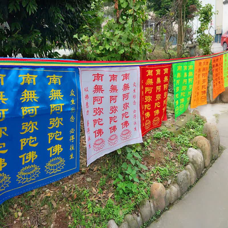 Tibetan Windhorse Lotus Prayer Flag Set - rainbow flags on cord in lush green setting