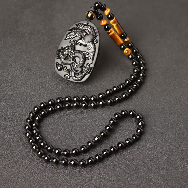 Black Obsidian Tiger Eye Dragon Phoenix Necklace – carved obsidian pendant with amber accents on bead strand, spiritual