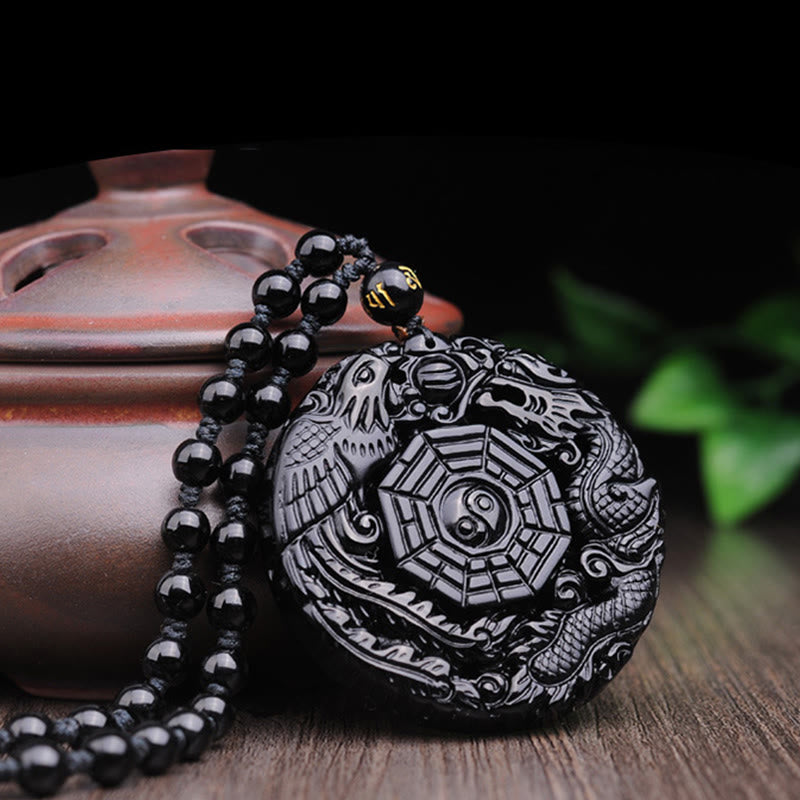 Bagua Dragon Phoenix Obsidian Pendant – Dragon-phoenix carving on ceramic prop, artisanal