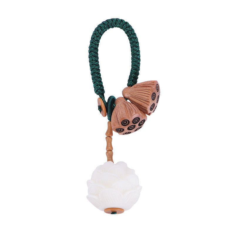 Bodhi Seed Peach Wood Lotus Keychain – Front-facing product shot of carved lotus charm with jade-like pendant and emerald cord, spiritual keychain
