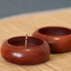 Rosewood Incense Burner – burning incense in front bowl, matching empty holder behind on bamboo mat, tranquil