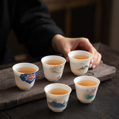 Ceramic Kung Fu Tea Cup – five-cup collection with lotus, peony, mountain and deer motifs on dark wood board, curated