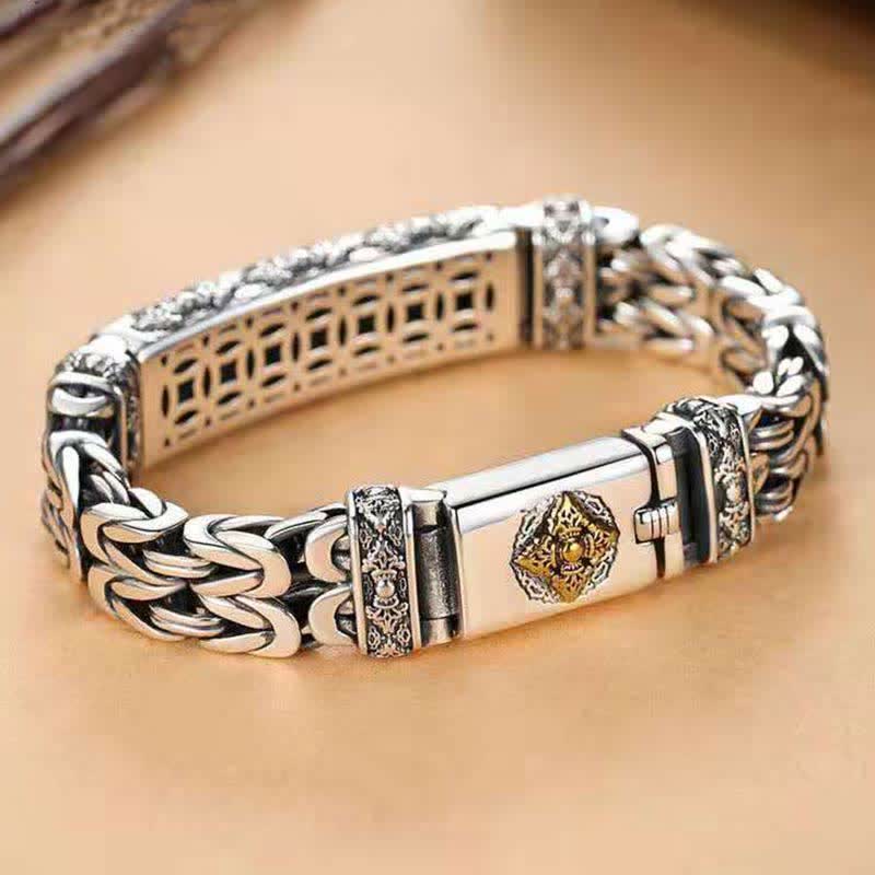 Vajra Dorje Copper Balance Bracelet - twisted braided copper chain bracelet with gold octagonal medallion centerpiece, ornate engraved spacer bands, box clasp closure, polished silver-tone finish on wood surface