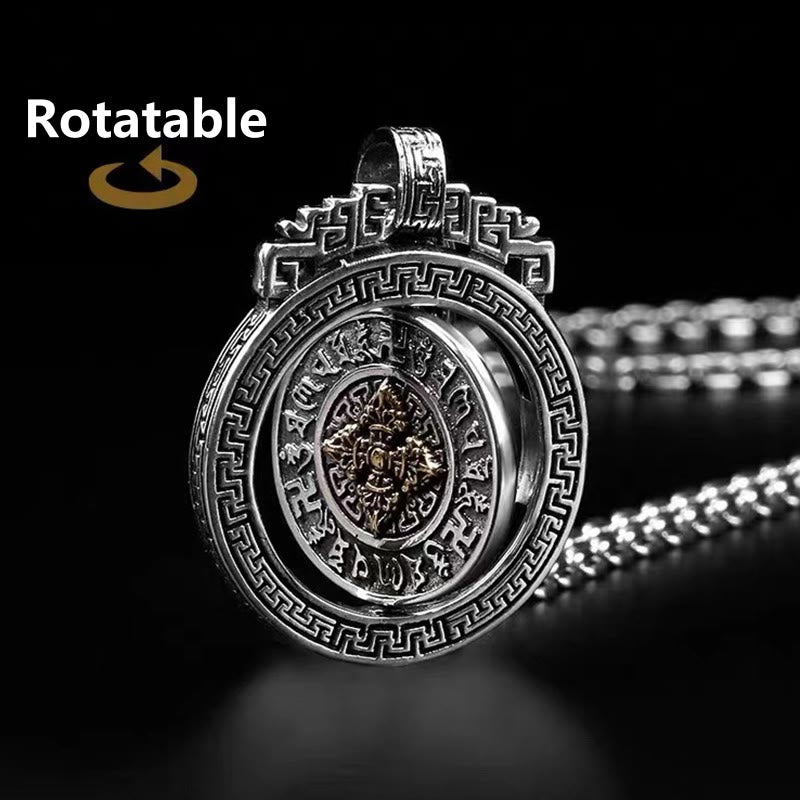 Double Dorje Vajra Rotatable Necklace – three concentric spinning rings on black surface, prayer wheel pendant