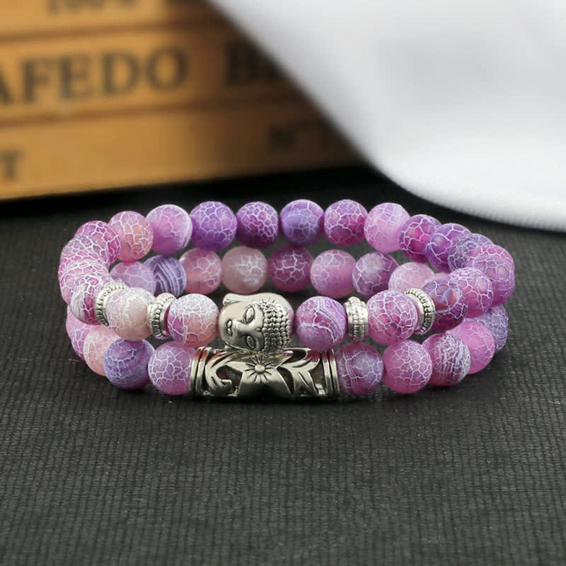 Tiger Eye Bracelet – Purple pink crackle agate Buddha bracelet on dark fabric, spiritual flatlay