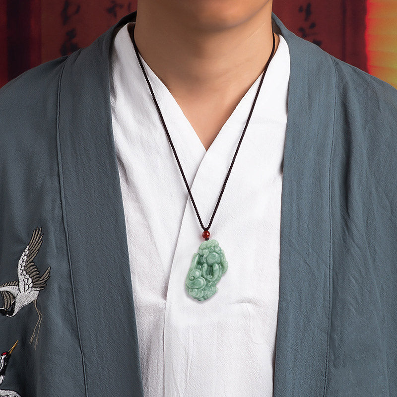 Jade PiXiu Necklace – Man wearing green jade Pixiu pendant under grey robe, spiritual wealth necklace