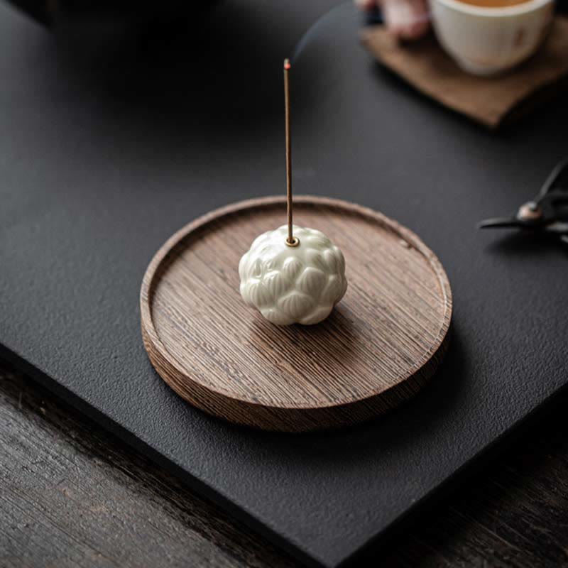 Ceramic Lotus Incense Burner with brass holder and incense smoke, relaxing aromatherapy