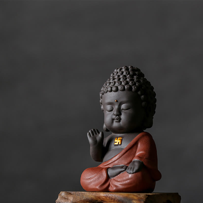 Small Buddha Purple Clay Decoration – right-side profile on wooden base, gold swastika detail, dark gray backdrop, Peaceful e