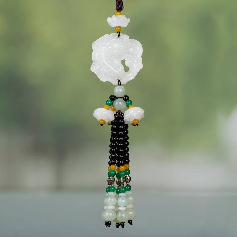 FengShui Jade PiXiu Car Pendant – white jade PiXiu ornament hanging, green blurred background, car mirror decoration