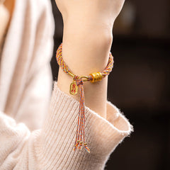Multicolored Tibetan Om Mani Padme Hum Ruyi Braided Bracelet – Worn on wrist, cream sweater, auspicious charm