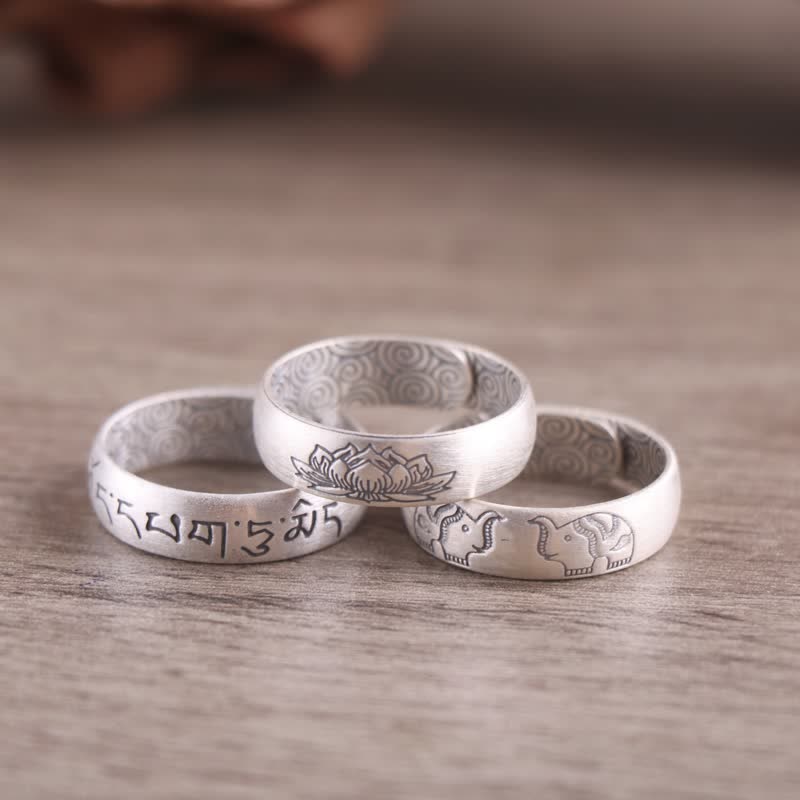 Sterling Silver Mantra Ring - triple ring stack on light wood, mantra lotus elephant, spiritual